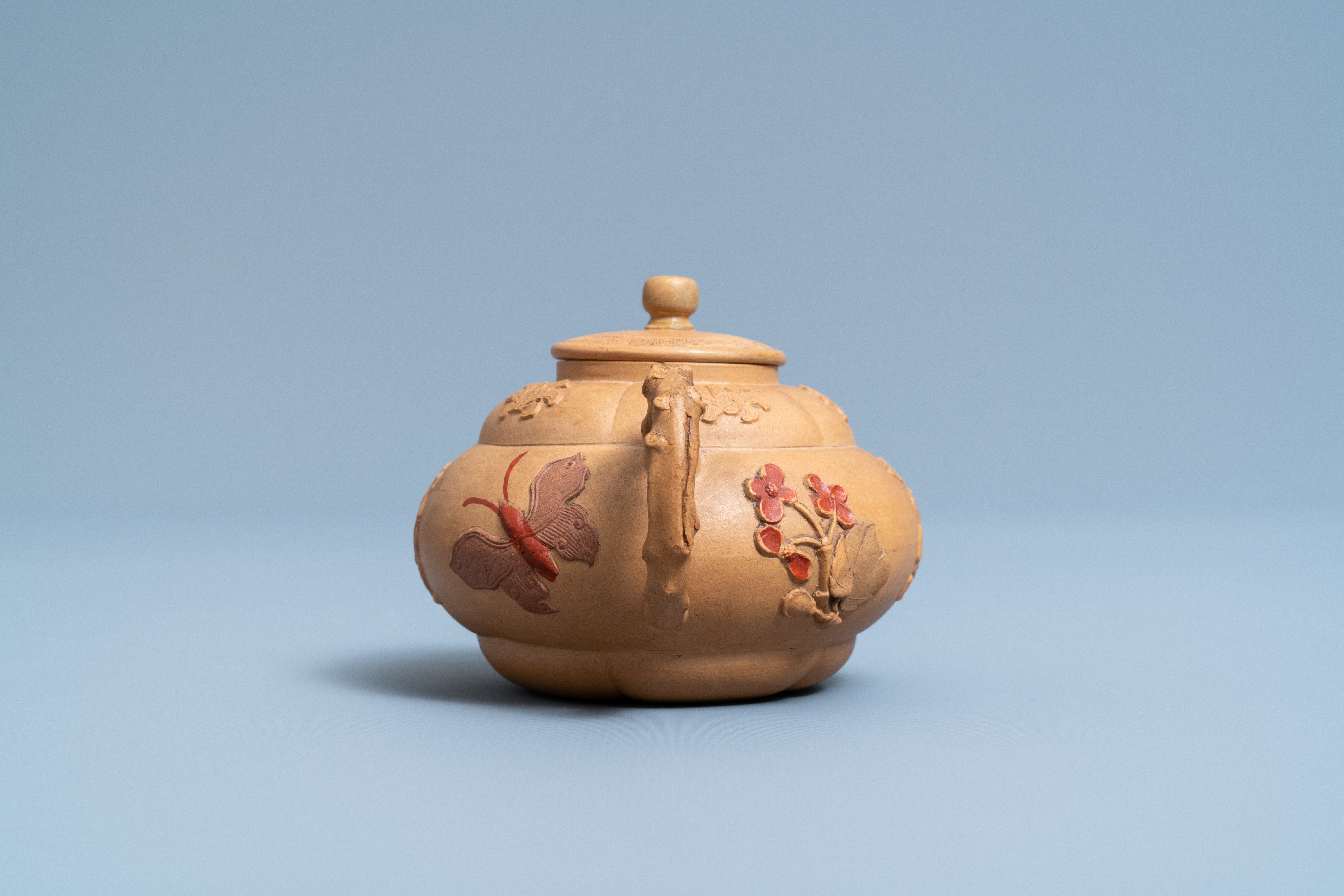 A bichrome Chinese Yixing stoneware teapot and cover with applied design, Kangxi - Image 5 of 7