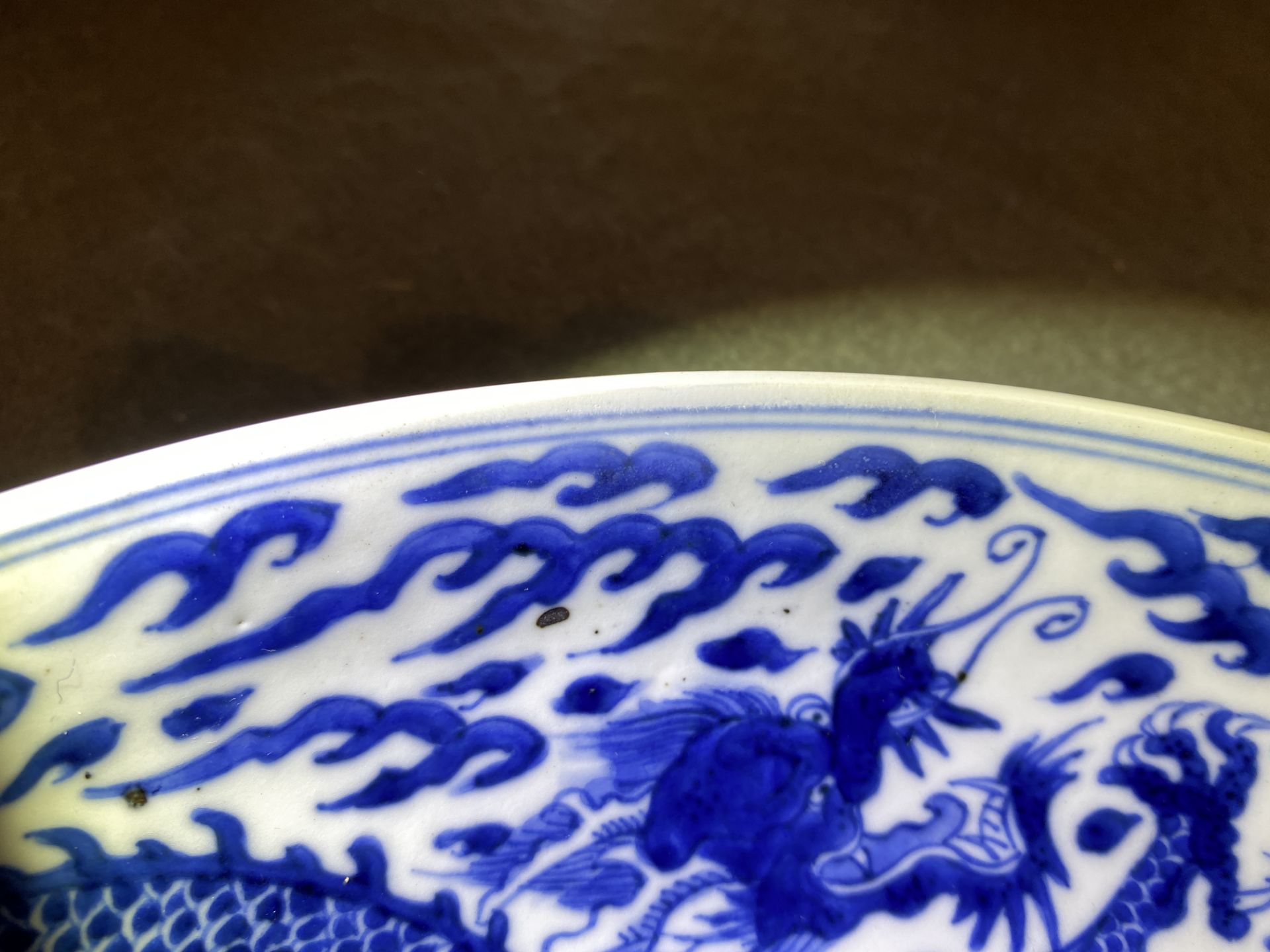 A Chinese blue and white 'dragon' dish, Kangxi mark and of the period - Image 7 of 12