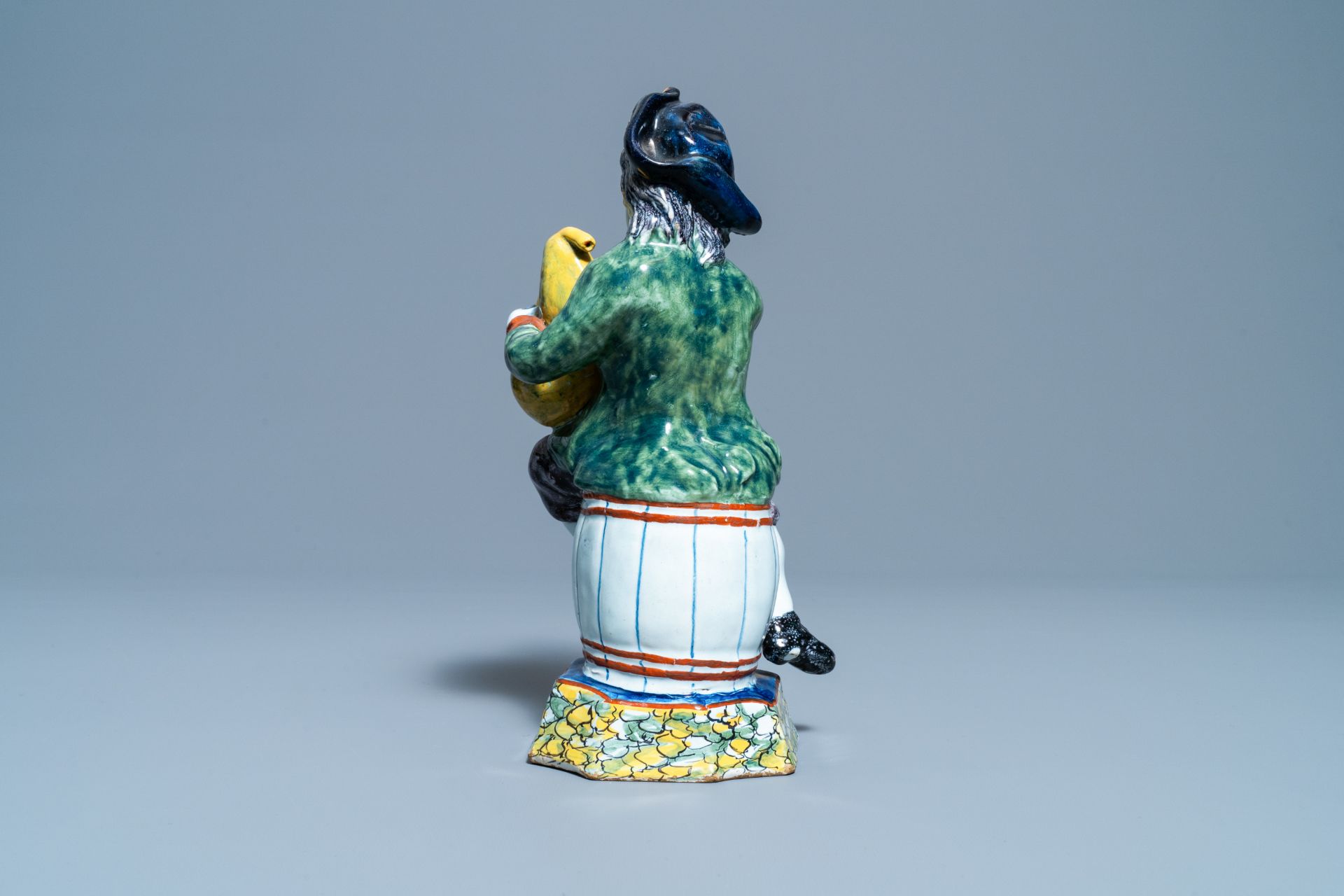 A polychrome Dutch Delft figure of a bagpipe player, 18th C. - Image 5 of 9