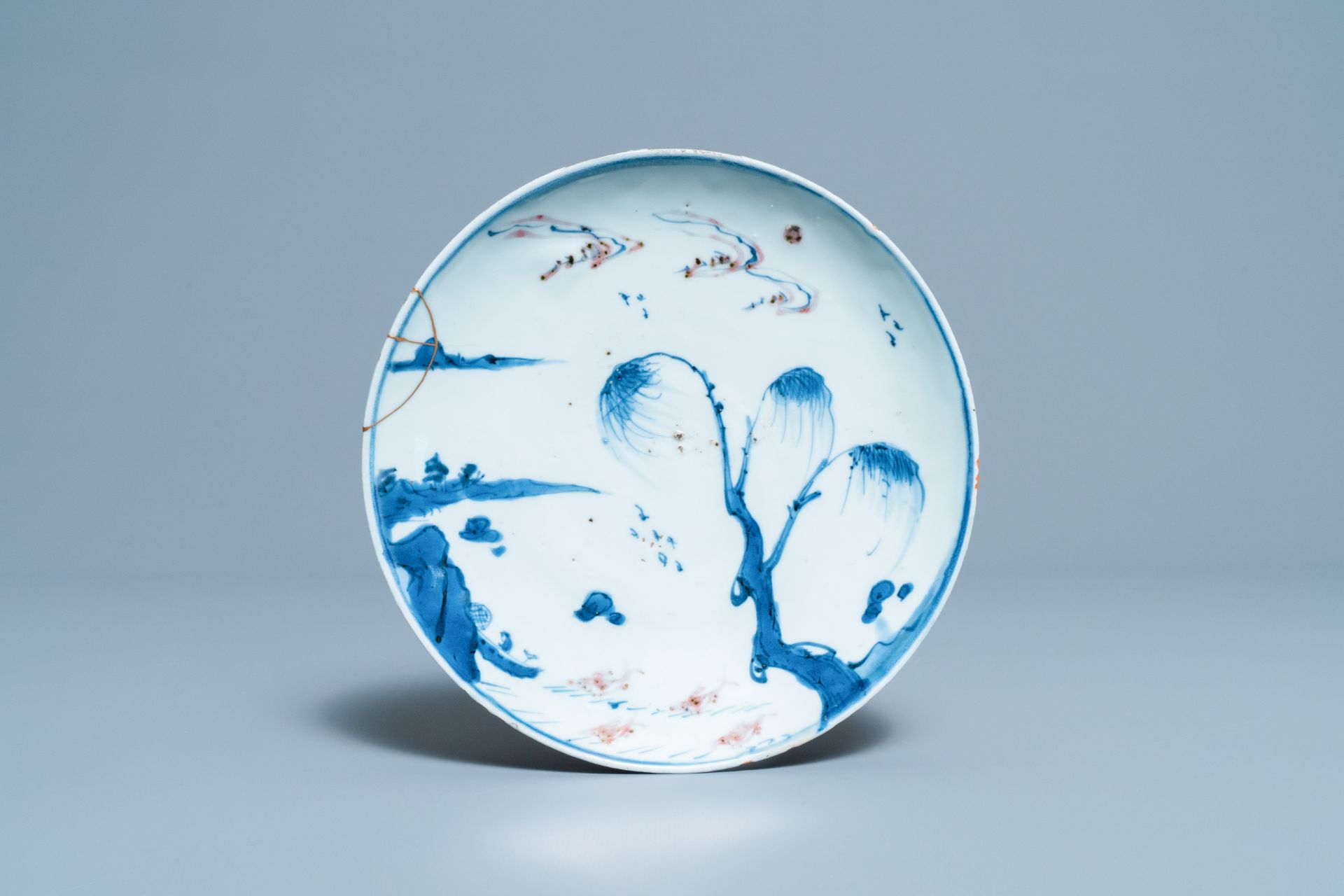 A Chinese blue, white and copper red 'fish' plate for the Japanese market, Transitional period