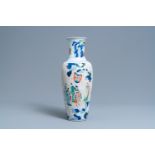 A Chinese wucai vase with continuous figurative design, 19th C.