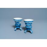 A pair of Chinese blue and white rococo-style tripod salts, Qianlong