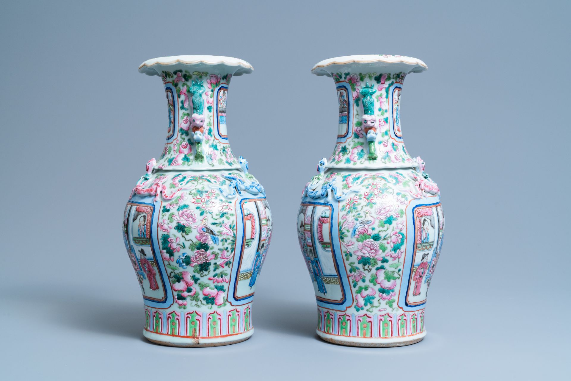 A pair of Chinese famille rose 'court scene' vases, 19th C. - Image 4 of 6