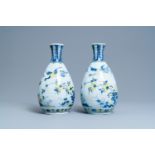 A pair of polychrome Dutch Delft chinoiserie vases with a dragon and birds in a flowery garden, 17th