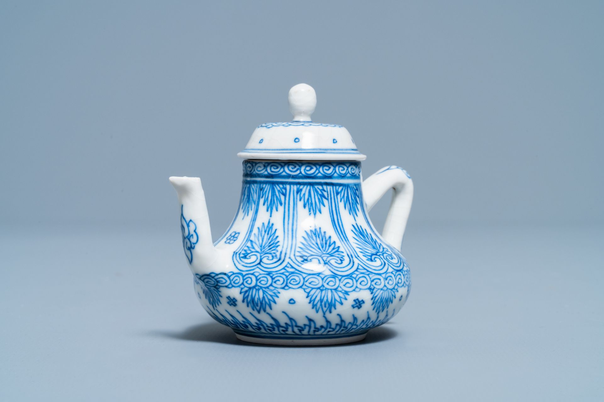 A Chinese blue and white soft paste miniature teapot, Kangxi