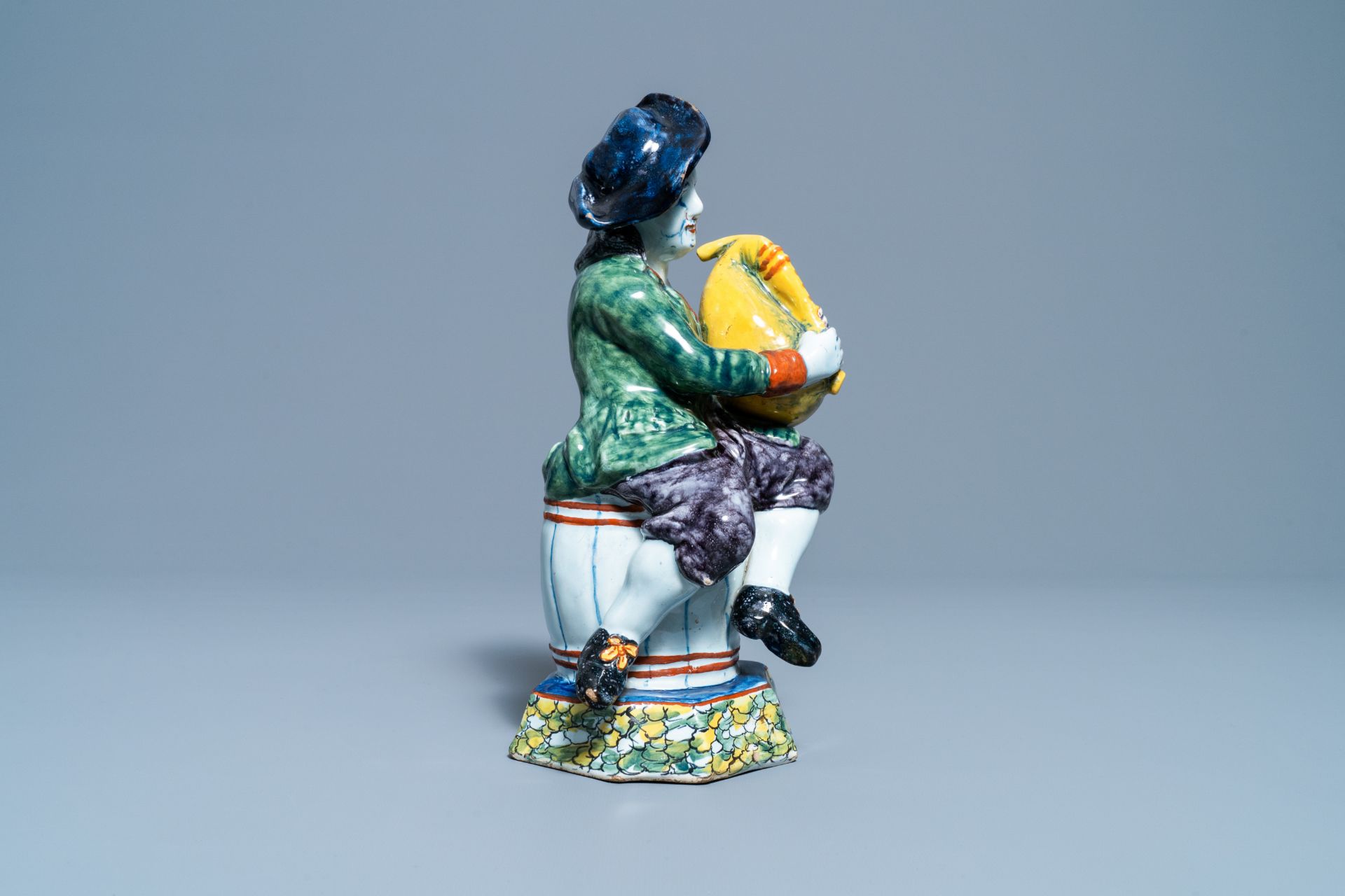 A polychrome Dutch Delft figure of a bagpipe player, 18th C. - Image 7 of 9