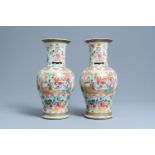 A pair of Chinese Canton famille rose vases, 19th C.