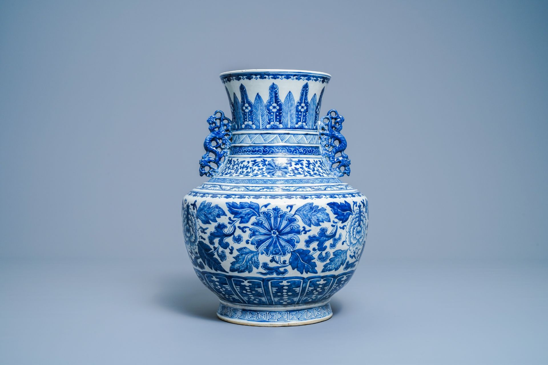 A Chinese blue and white 'hu' vase with floral design, Qianlong mark, 19th C. - Image 3 of 10
