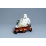 A Chinese famille rose figure of the reclining Buddha, seal mark, Republic