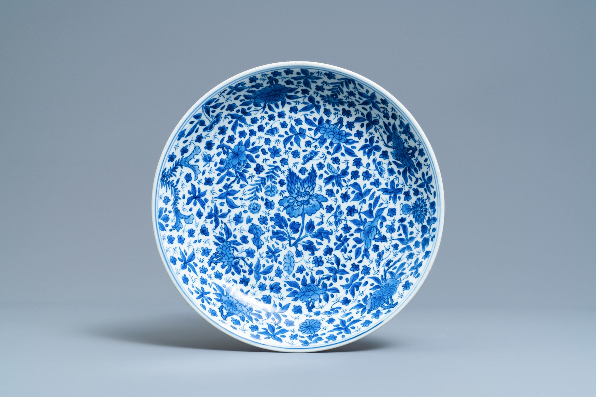 A Chinese blue and white charger with floral design, Kangxi