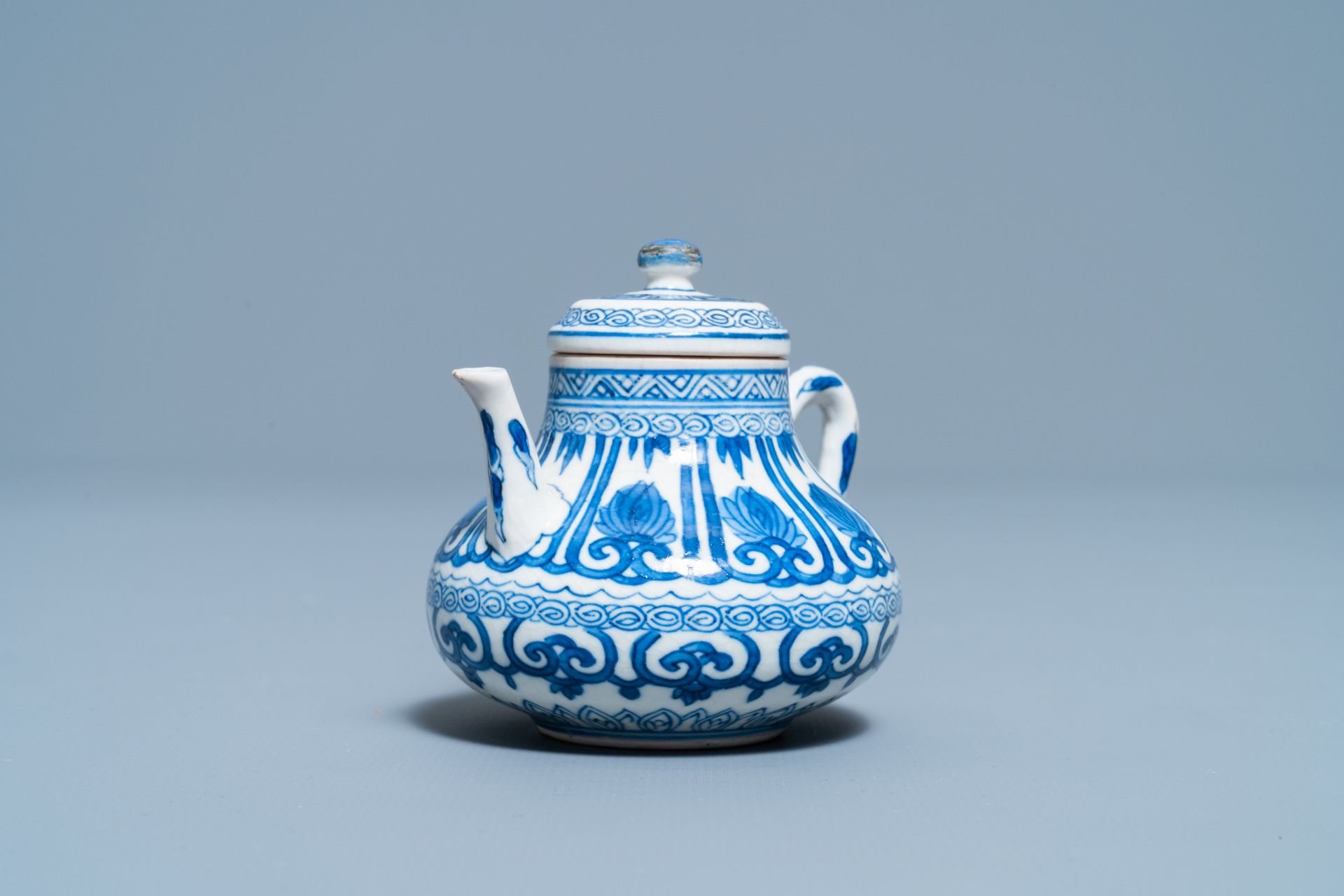 A Chinese blue and white soft paste miniature teapot, Kangxi