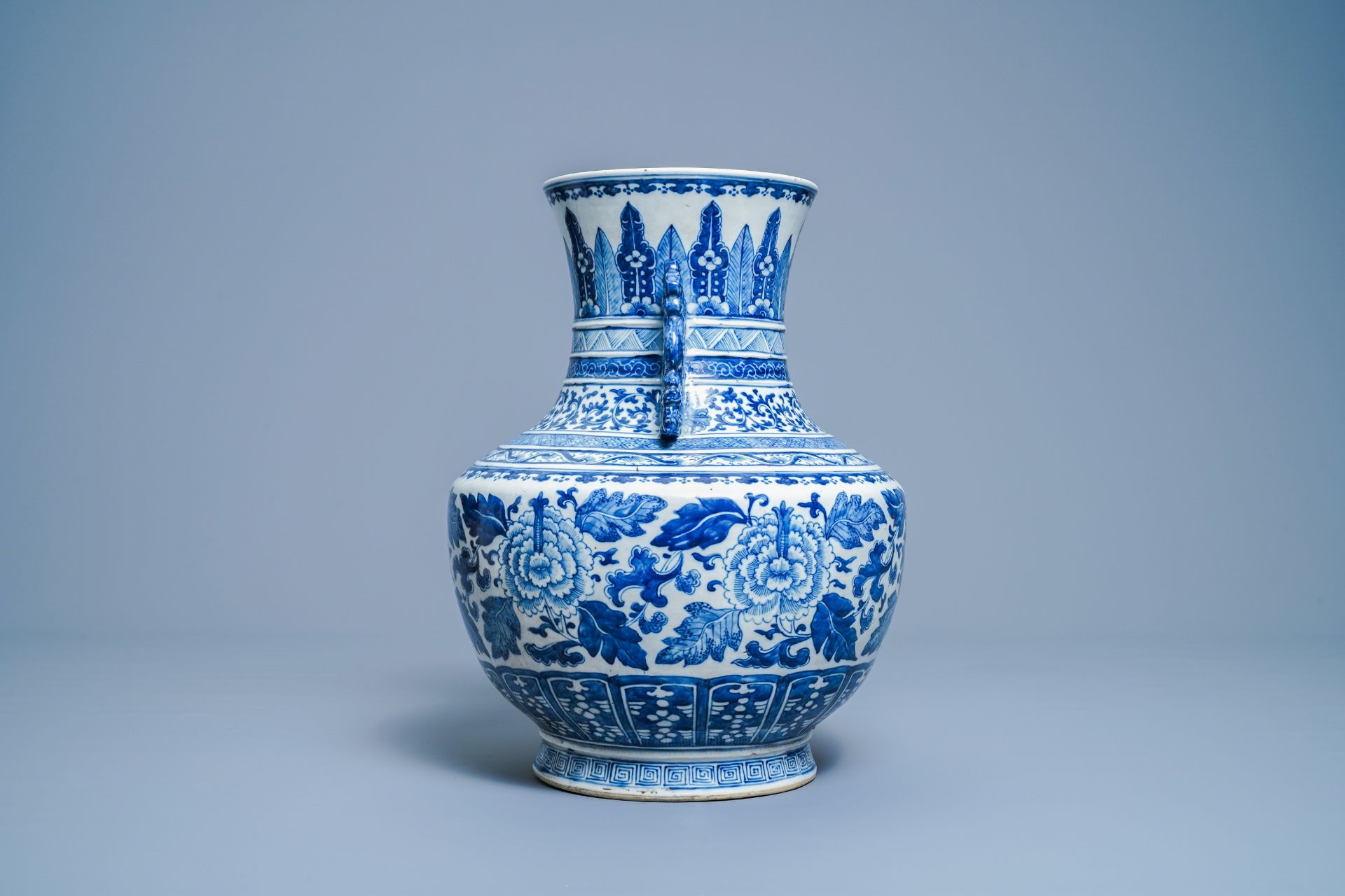 A Chinese blue and white 'hu' vase with floral design, Qianlong mark, 19th C. - Image 2 of 10