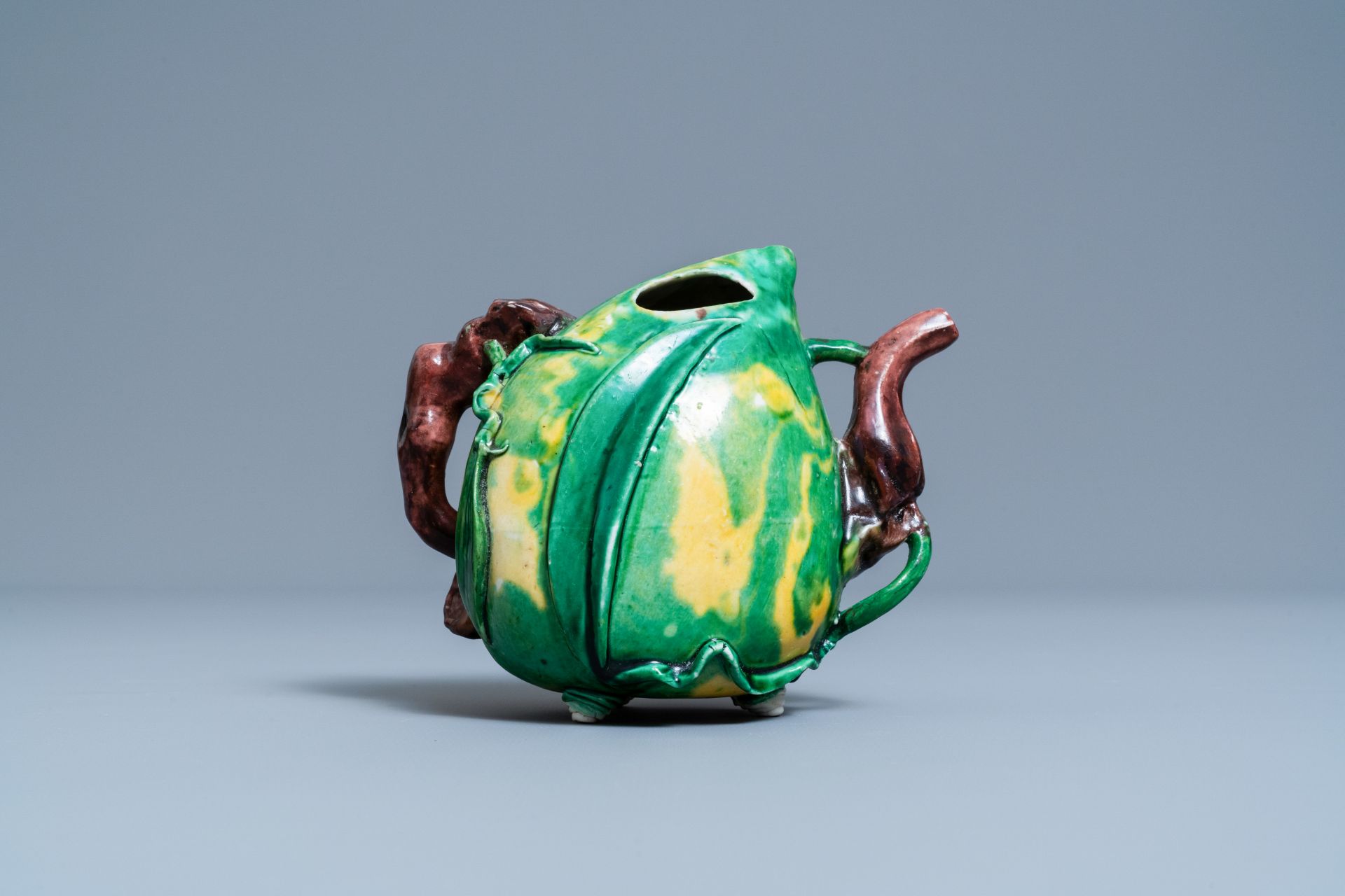 A Chinese verte biscuit peach-shaped 'cadogan' teapot, Kangxi - Image 4 of 7