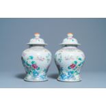 A pair of Chinese famille rose vases and covers, 19th C.