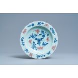 A Chinese blue, white and copper red celadon-ground dish, Qianlong mark and of the period