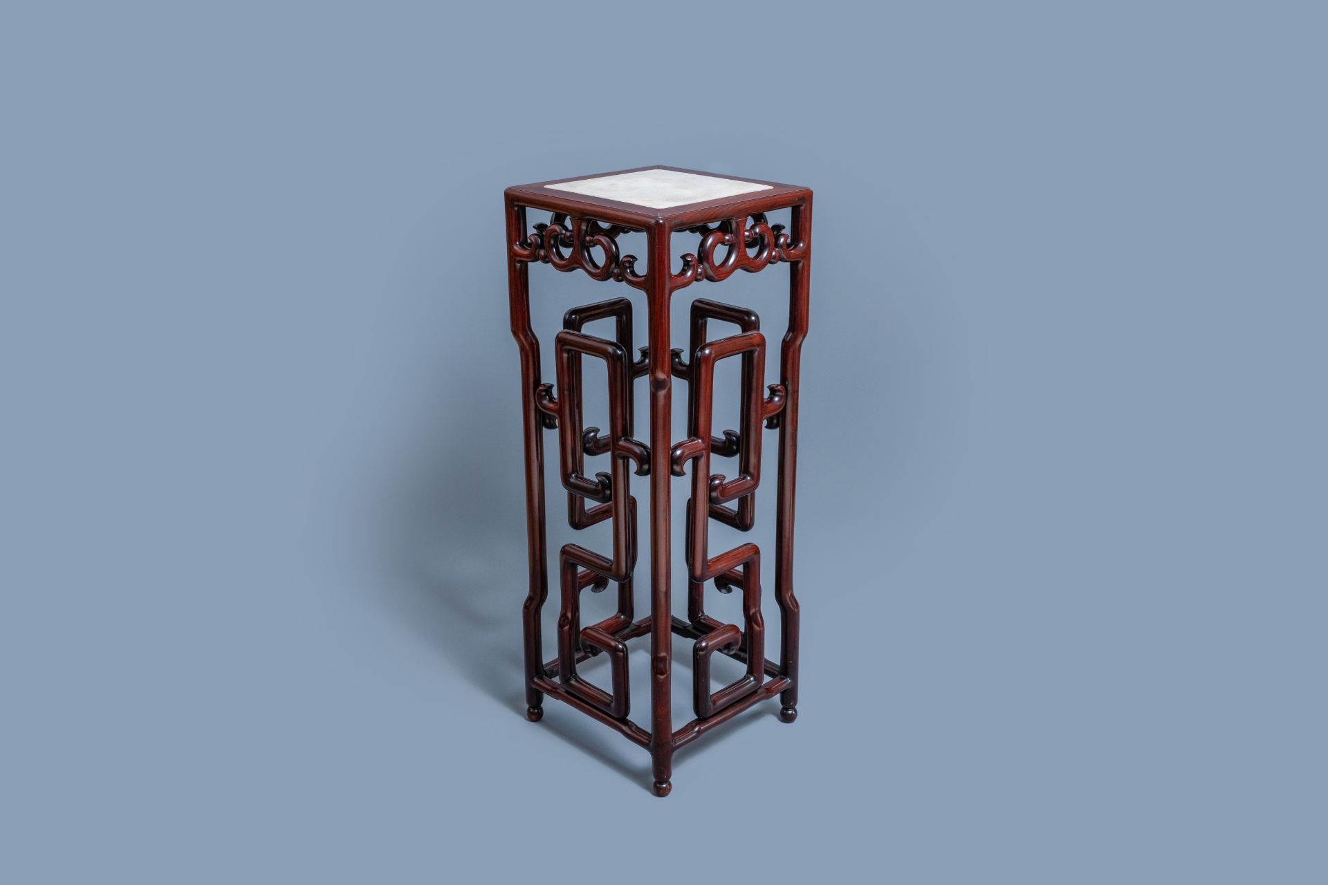 A tall Chinese marble-inlaid wooden stand, 20th C.