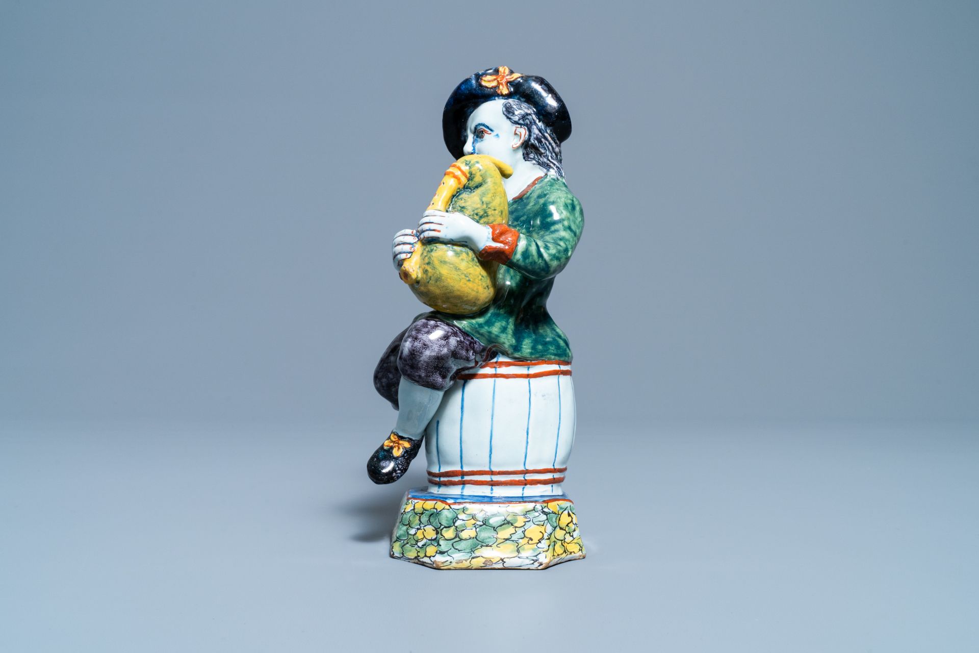 A polychrome Dutch Delft figure of a bagpipe player, 18th C. - Image 4 of 9