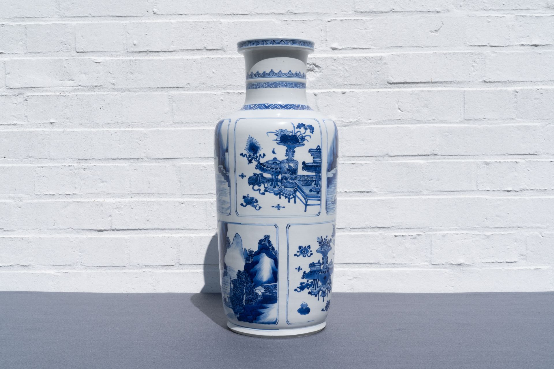 A Chinese blue and white 'antiquities and landscapes' rouleau vase, Kangxi - Image 12 of 35