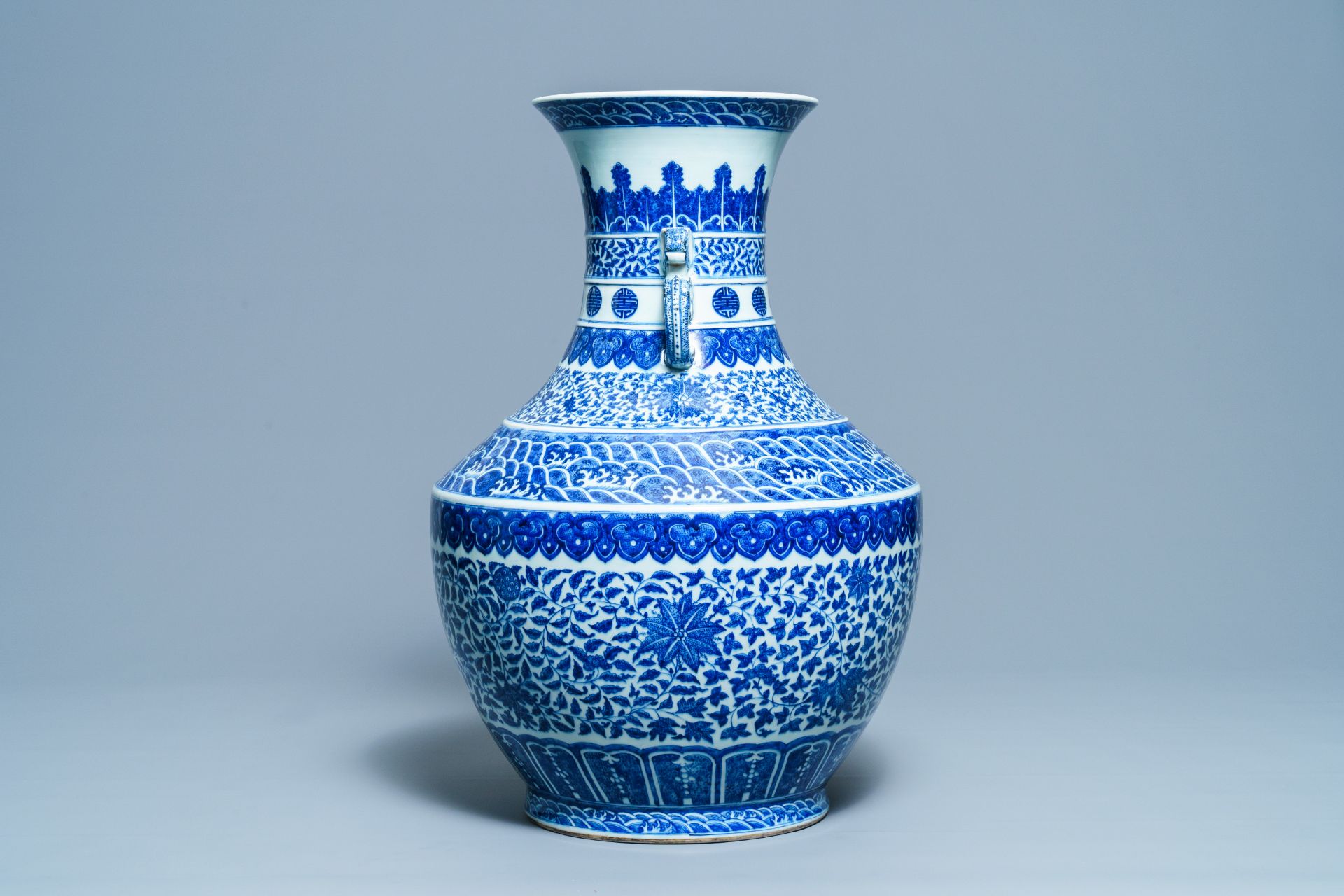 A large Chinese blue and white 'hu' vase with floral scrolls, Qianlong mark, 19th C - Image 2 of 6