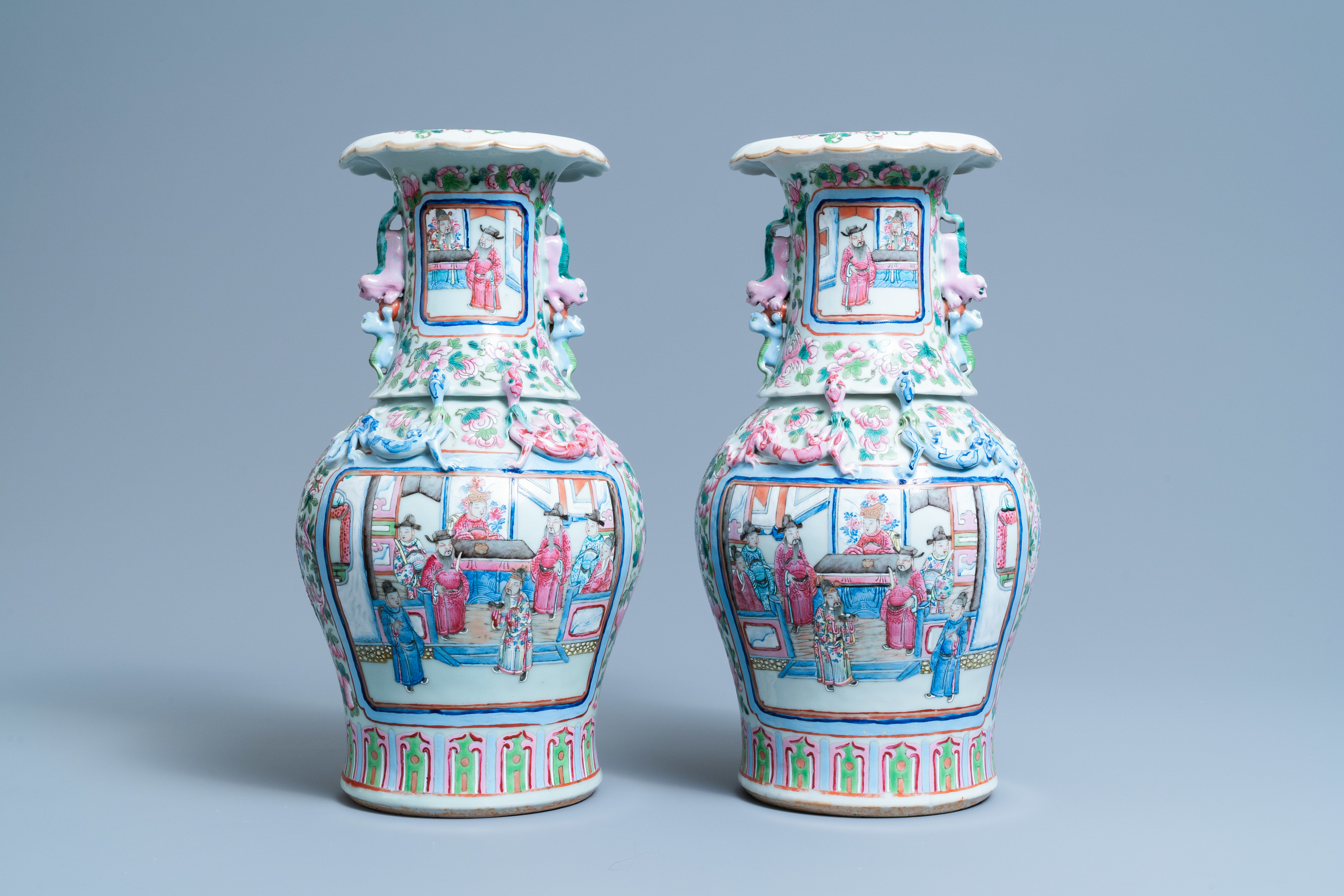 A pair of Chinese famille rose 'court scene' vases, 19th C.