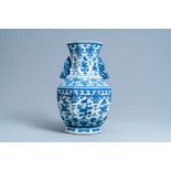 A Chinese blue and white hexagonal 'hu' vase with floral design, Qianlong mark, 19th C.