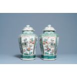 A pair of Chinese octagonal famille verte vases and covers, 19th C.