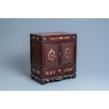 A Chinese mother-of-pearl-inlaid wooden two-door cabinet, 19th C.