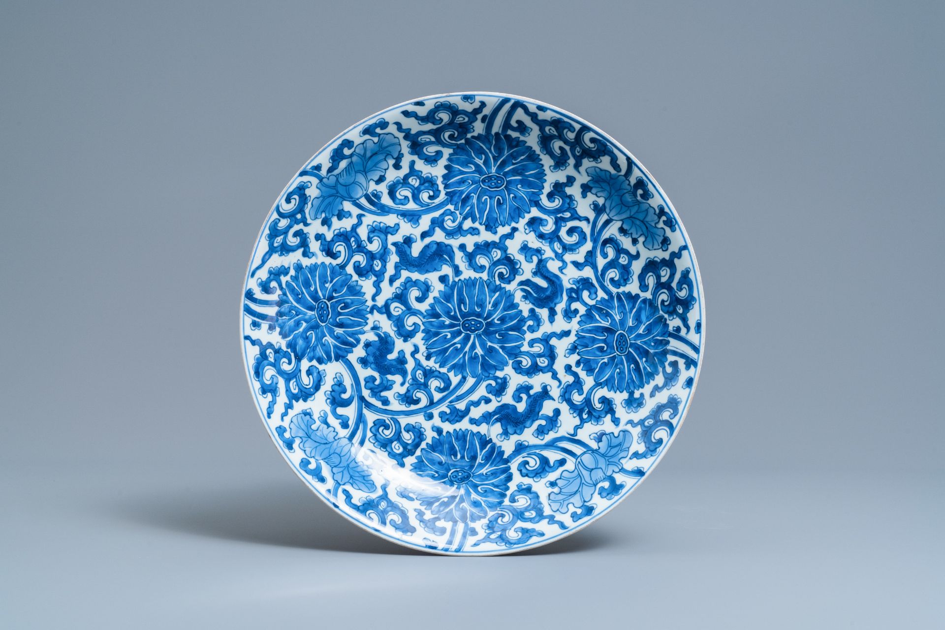 A pair of Chinese blue and white 'lotus scroll' chargers, Kangxi - Image 2 of 5