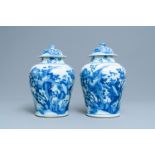 A pair of Chinese blue & white baluster vases & covers with birds, Kangxi