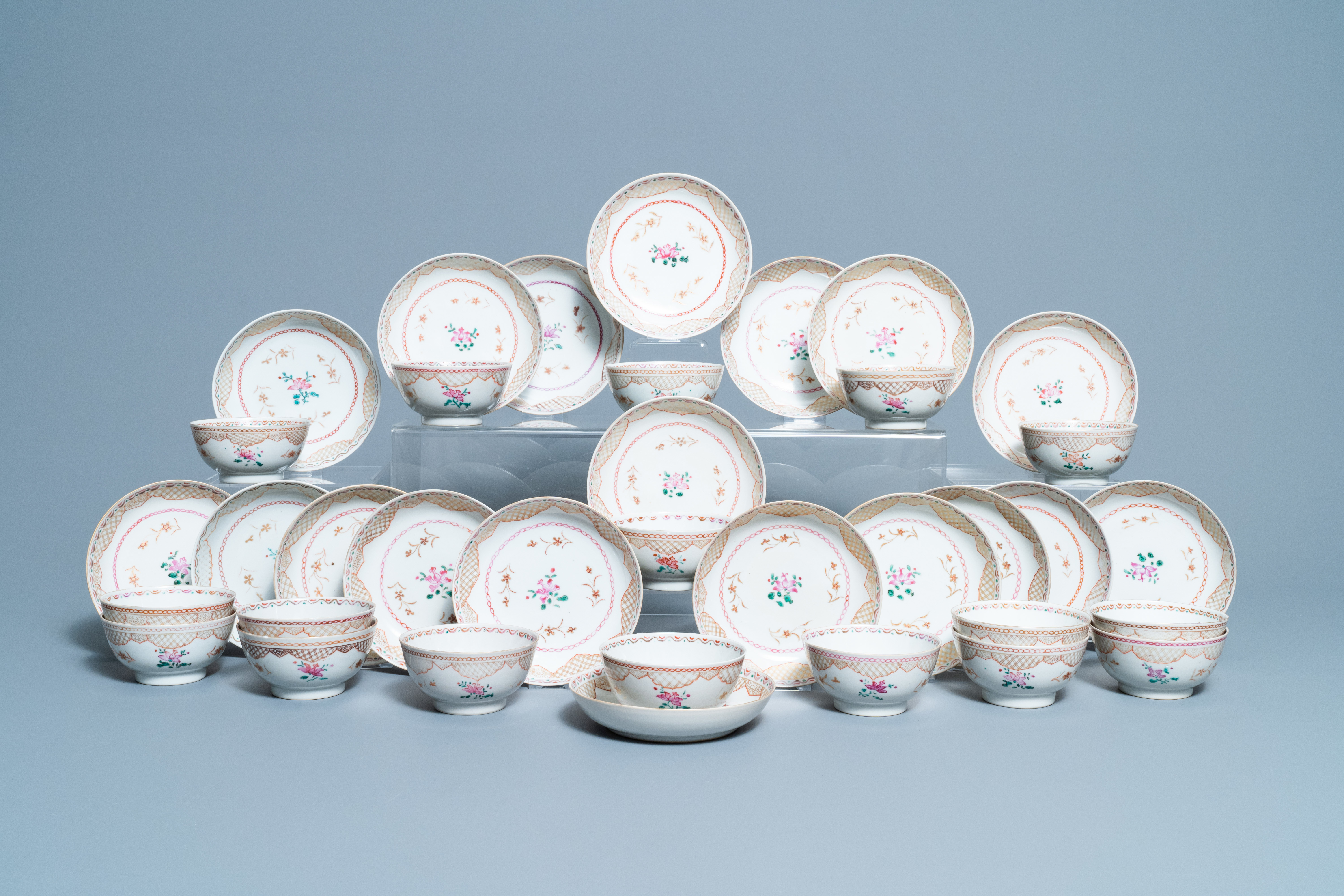 Seventeen Chinese famille rose cups and nineteen saucers, Qianlong