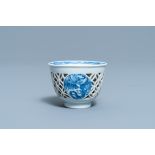 A rare Chinese blue and white reticulated double-walled 'fenix' cup, Transitional period