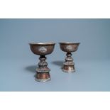 A pair of Tibetan silvered copper alloy altar bowls, 19/20th C.