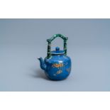 A Chinese powder blue and gilt teapot with verte biscuit handle, Kangxi