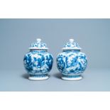 A pair of Chinese blue and white 'hunting scene' jars and covers, Kangxi