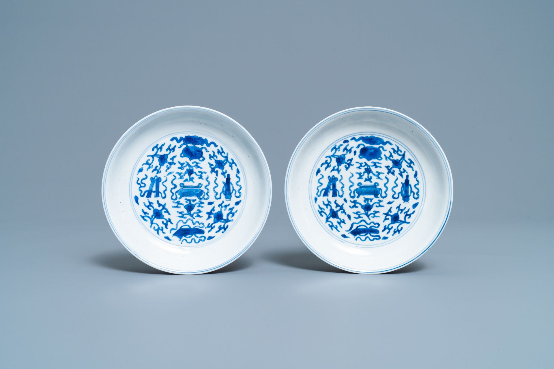 A pair of Chinese blue and white plates with taoist symbols, Kangxi mark & period - Image 2 of 3