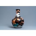 A Chinese famille noire 'dragon' bottle vase, 19th C.