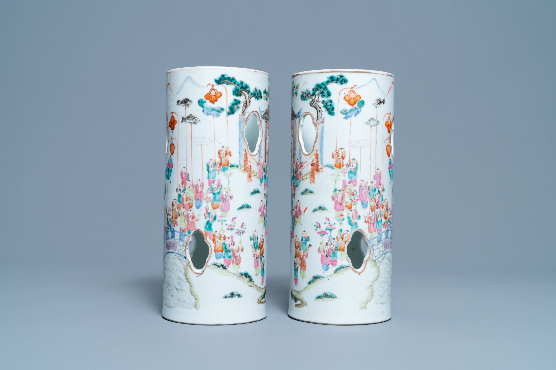 A pair of reticulated Chinese famille rose '100 boys' hat stands, Qianlong mark, 19th C. - Image 2 of 6
