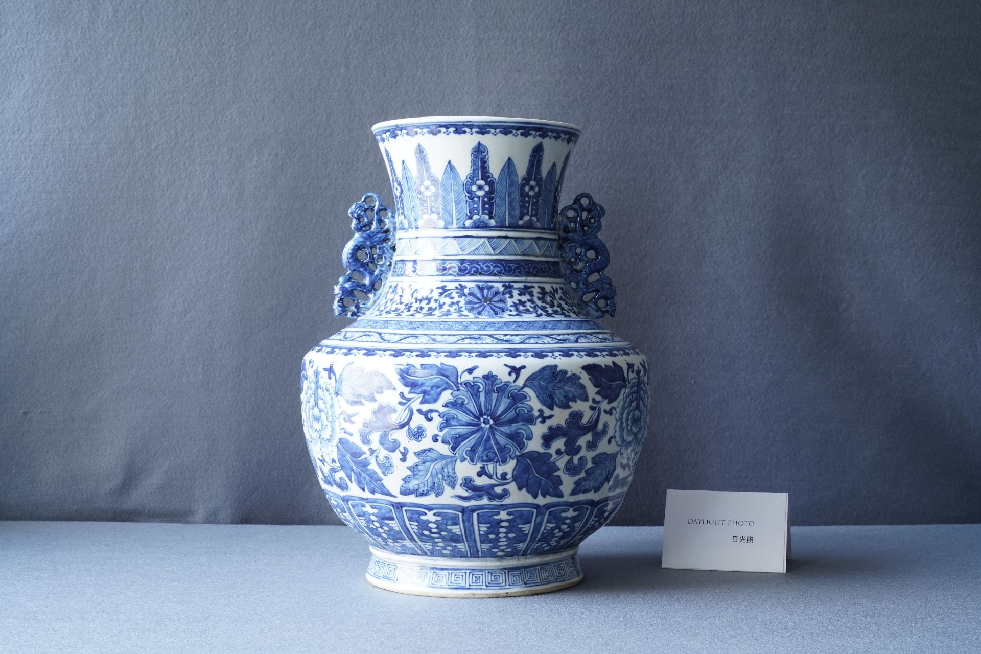 A Chinese blue and white 'hu' vase with floral design, Qianlong mark, 19th C. - Image 7 of 10