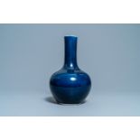 A Chinese monochrome 'sacrificial blue'-glazed bottle vase, Qianlong mark and of the period