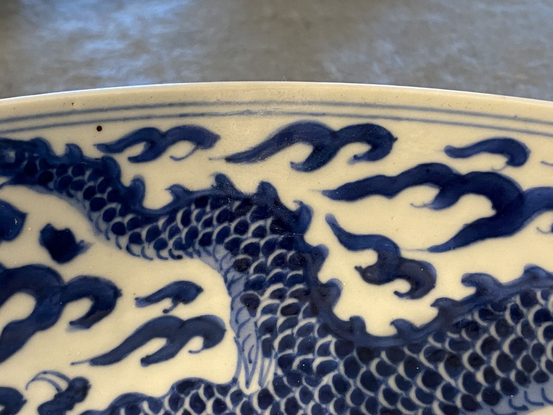 A Chinese blue and white 'dragon' dish, Kangxi mark and of the period - Image 8 of 12