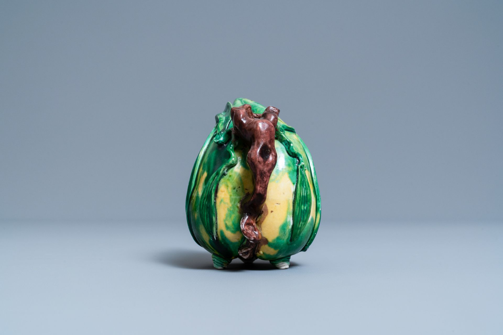 A Chinese verte biscuit peach-shaped 'cadogan' teapot, Kangxi - Image 3 of 7