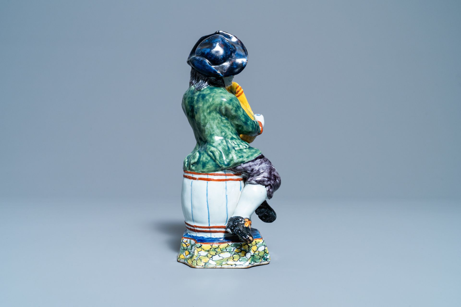 A polychrome Dutch Delft figure of a bagpipe player, 18th C. - Image 6 of 9