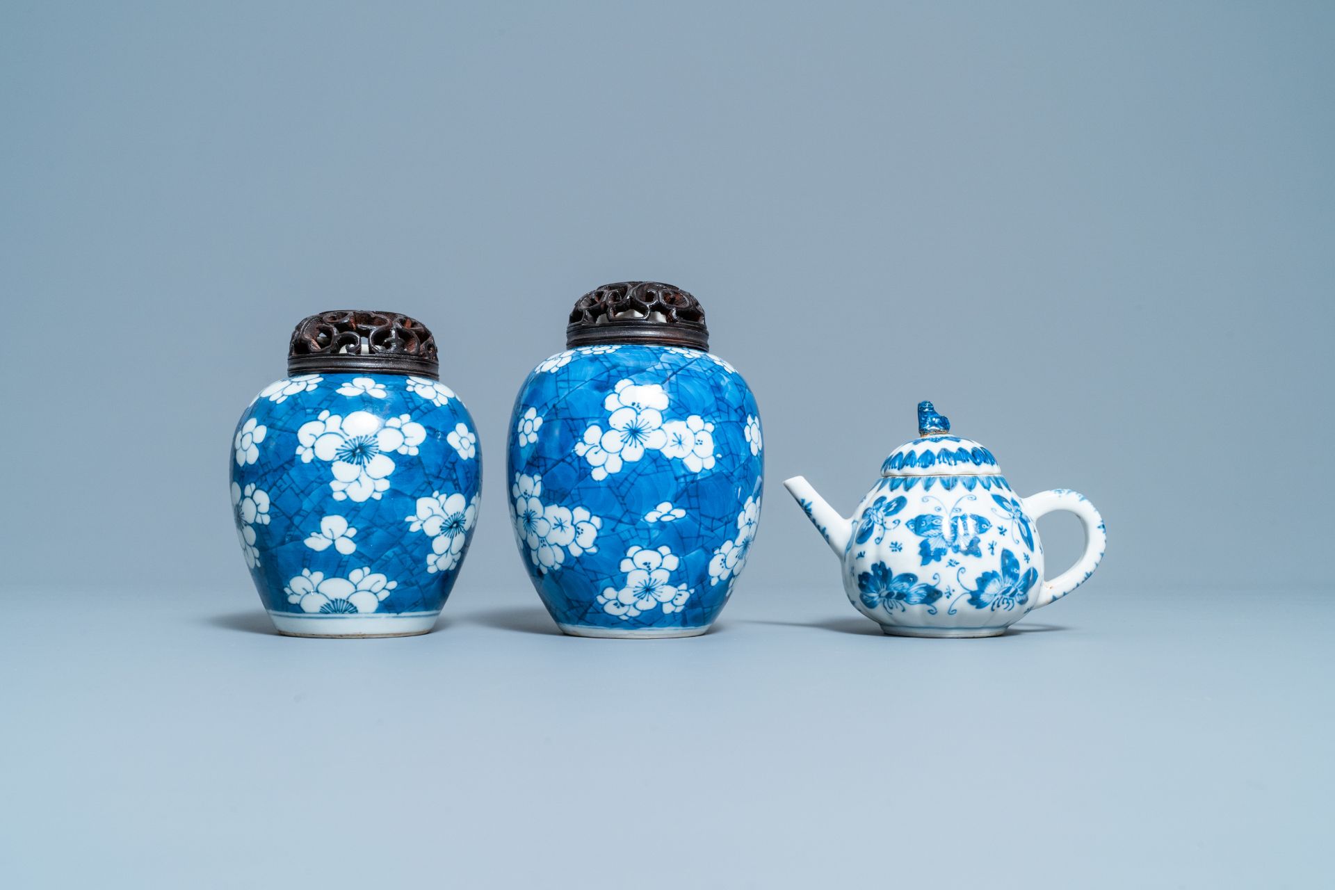 A pair of Chinese blue & white 'prunus' jars & a 'butterfly' teapot & cover, Kangxi - Image 2 of 8