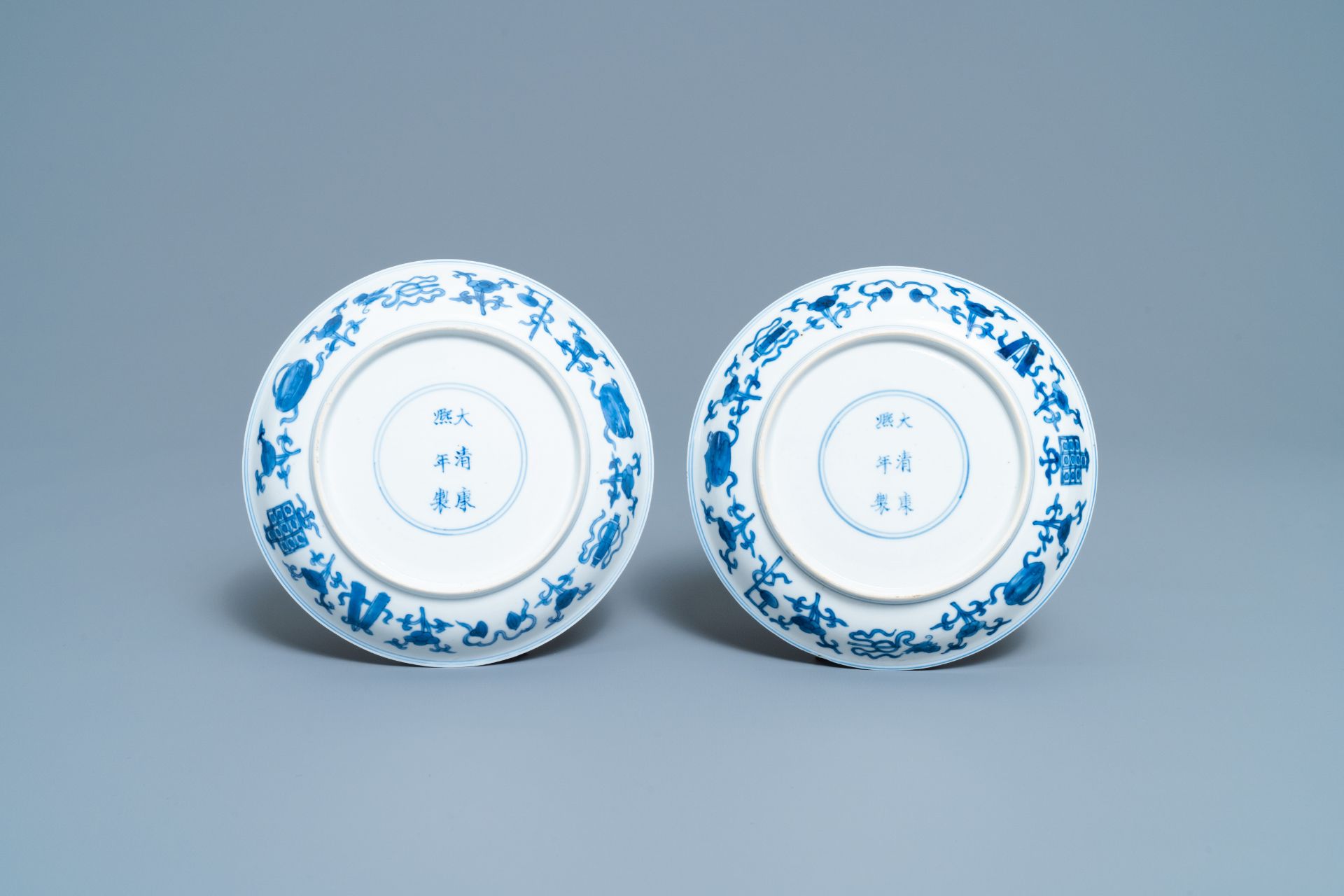 A pair of Chinese blue and white plates with taoist symbols, Kangxi mark & period - Image 3 of 3