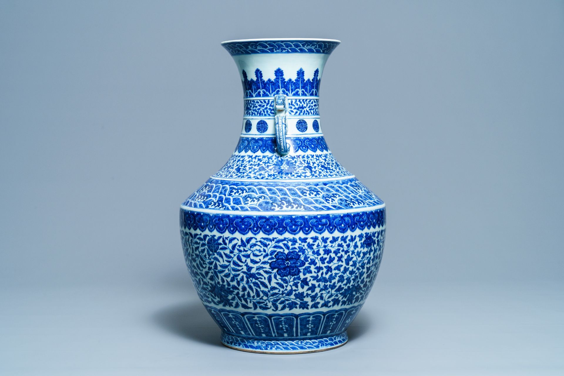 A large Chinese blue and white 'hu' vase with floral scrolls, Qianlong mark, 19th C - Image 4 of 6