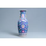 A Chinese famille rose blue-ground vase, 19th C.