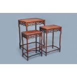 Three Chinese wooden nesting side tables, 19th C.