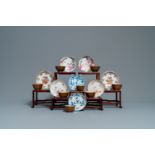 Eight Chinese fam. rose, blue & white & iron-red capucin cups and saucers, Kangxi/Qianlong