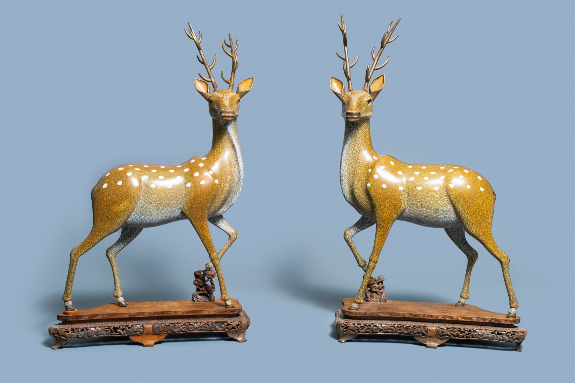 An exceptional and large pair of Chinese cloisonné models of deer, Qianlong/Jiaqing