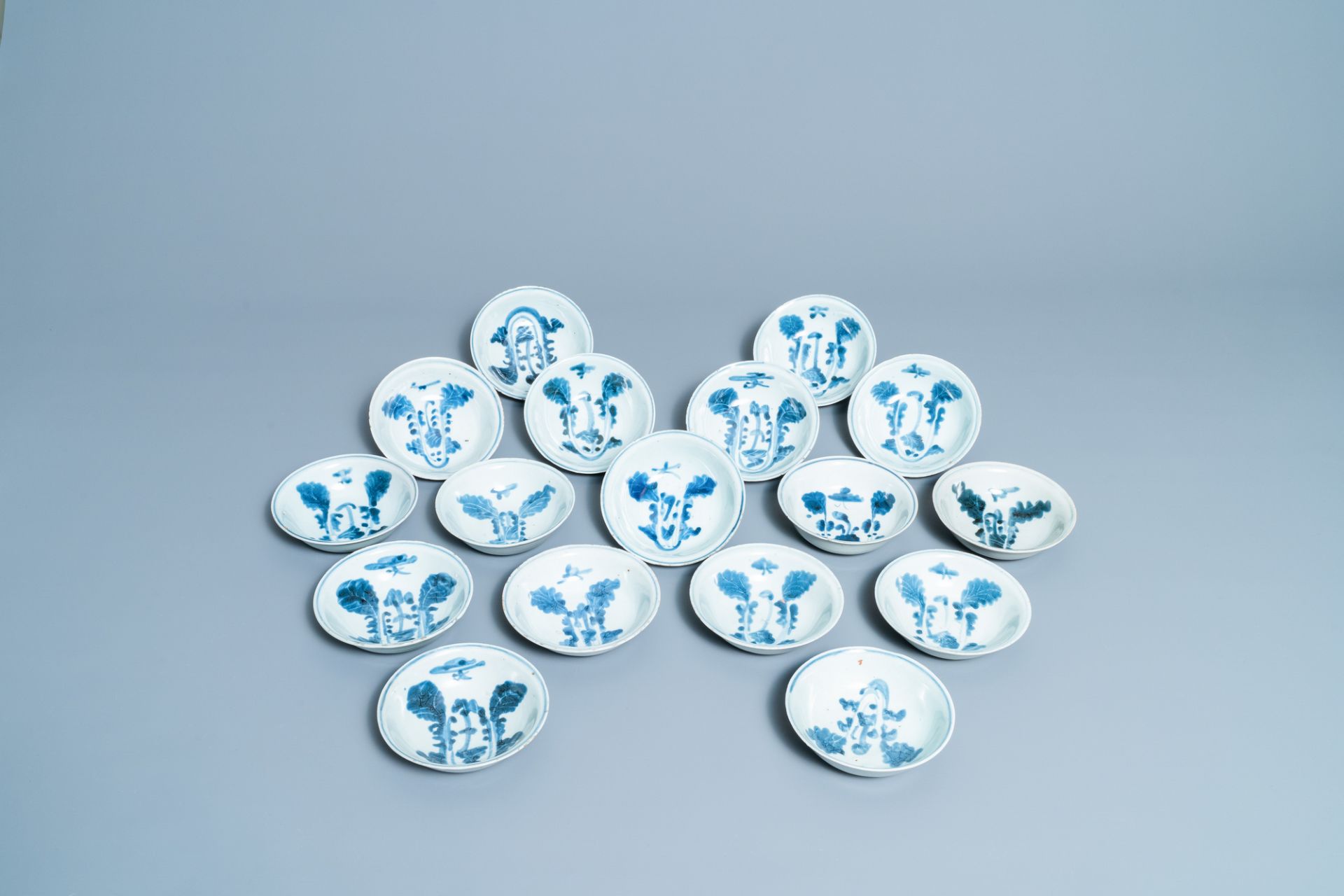 Seventeen Chinese blue and white 'cabbage' bowls, Transitional period